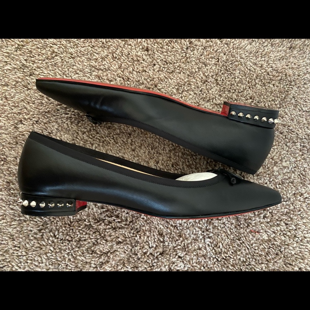 CHRISTIAN LOUBOUTIN
Nappa Spiked Hall Flats